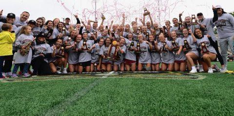 WLAX teams with championship trophy