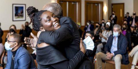 MLK Scholarship winner Kudzai Kapurura hugging someone